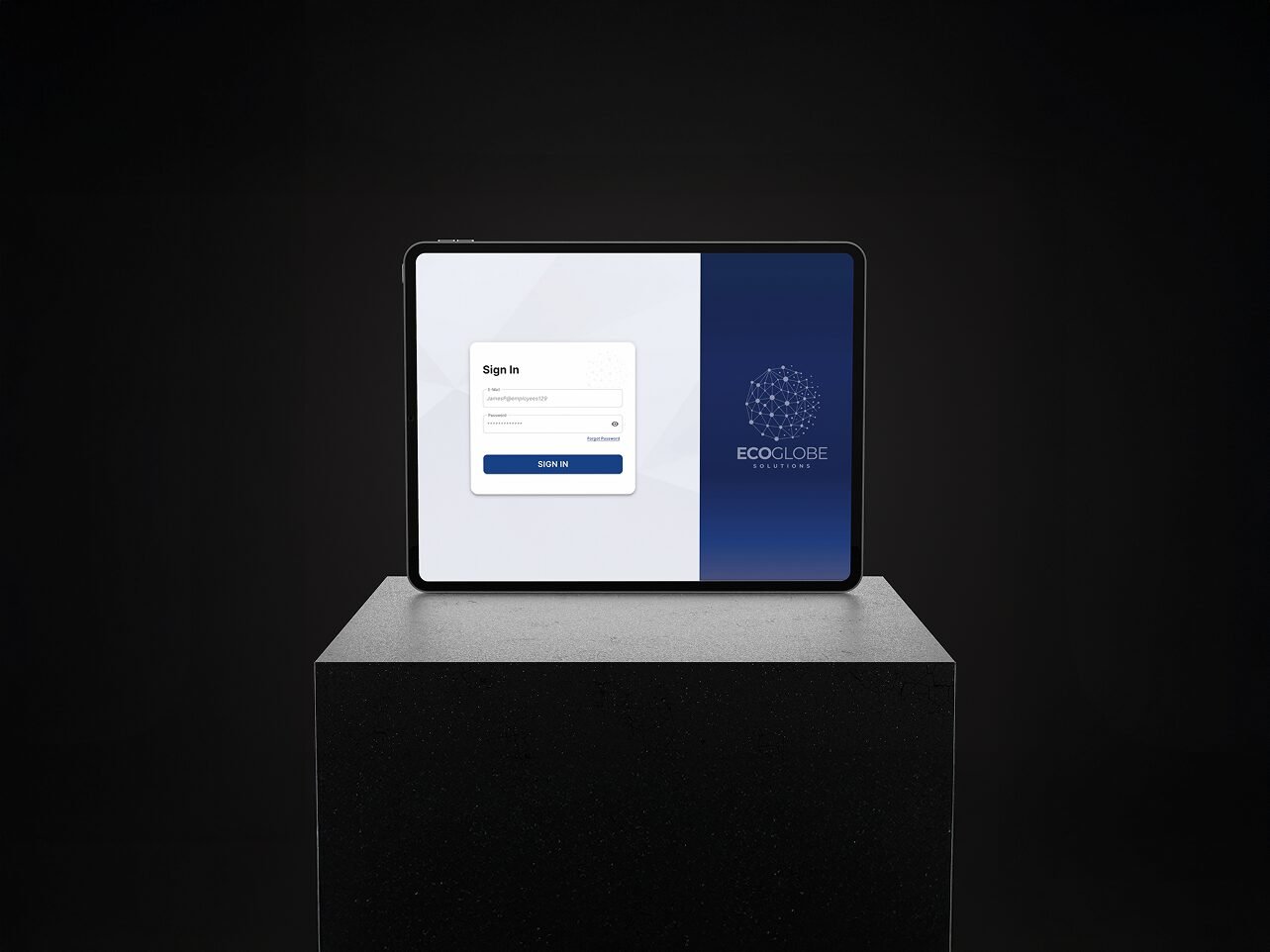 Tablet displaying EcoGlobe Solutions login screen with email and password fields, placed on a dark pedestal against a black background.